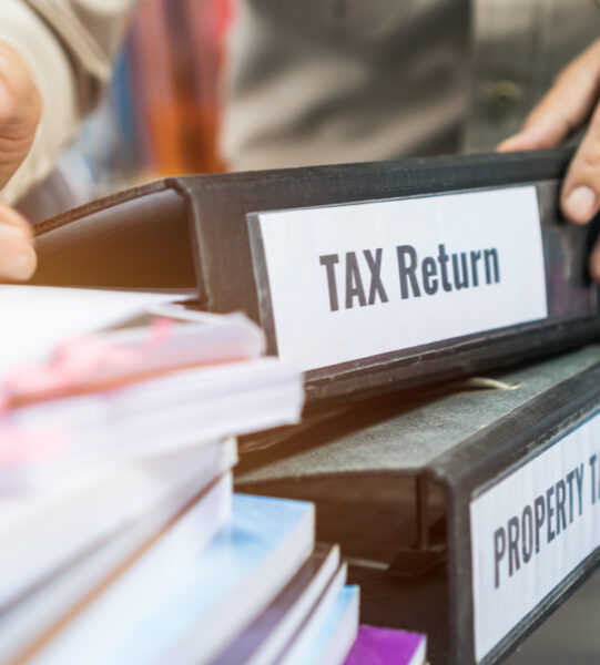 tax-return-property-tax-folders-stack-with-label-black-binder-paperwork-document-summary-report